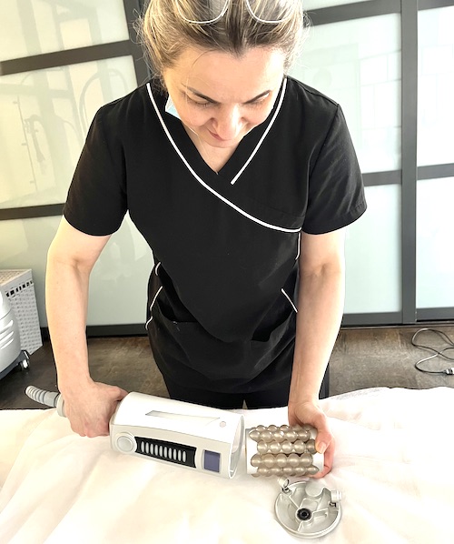 Esthetician preparing for lymphatic drainage massage in Yorkville Toronto
