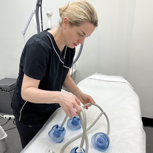 Starvac device providing lymphatic drainage therapy to boost circulation and metabolism.
